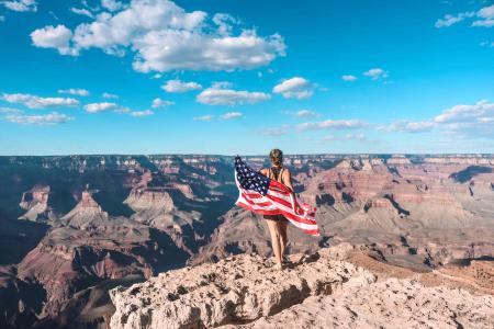 au pair with us flag overlooking the Grand Canyon
